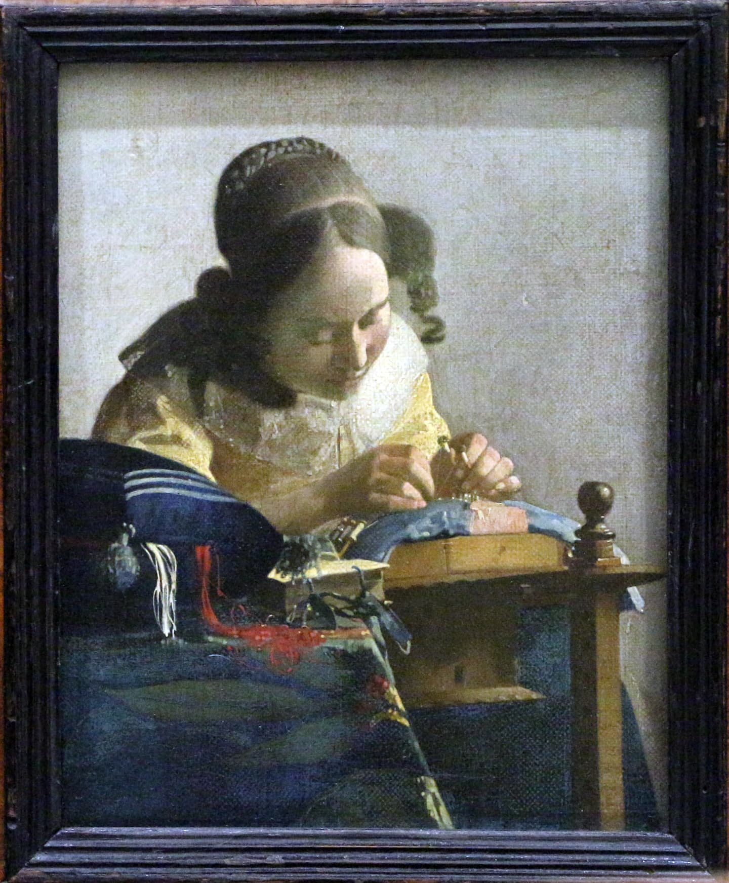 Vermeer's The Lacemaker, a woman absorbed in delicate handwork