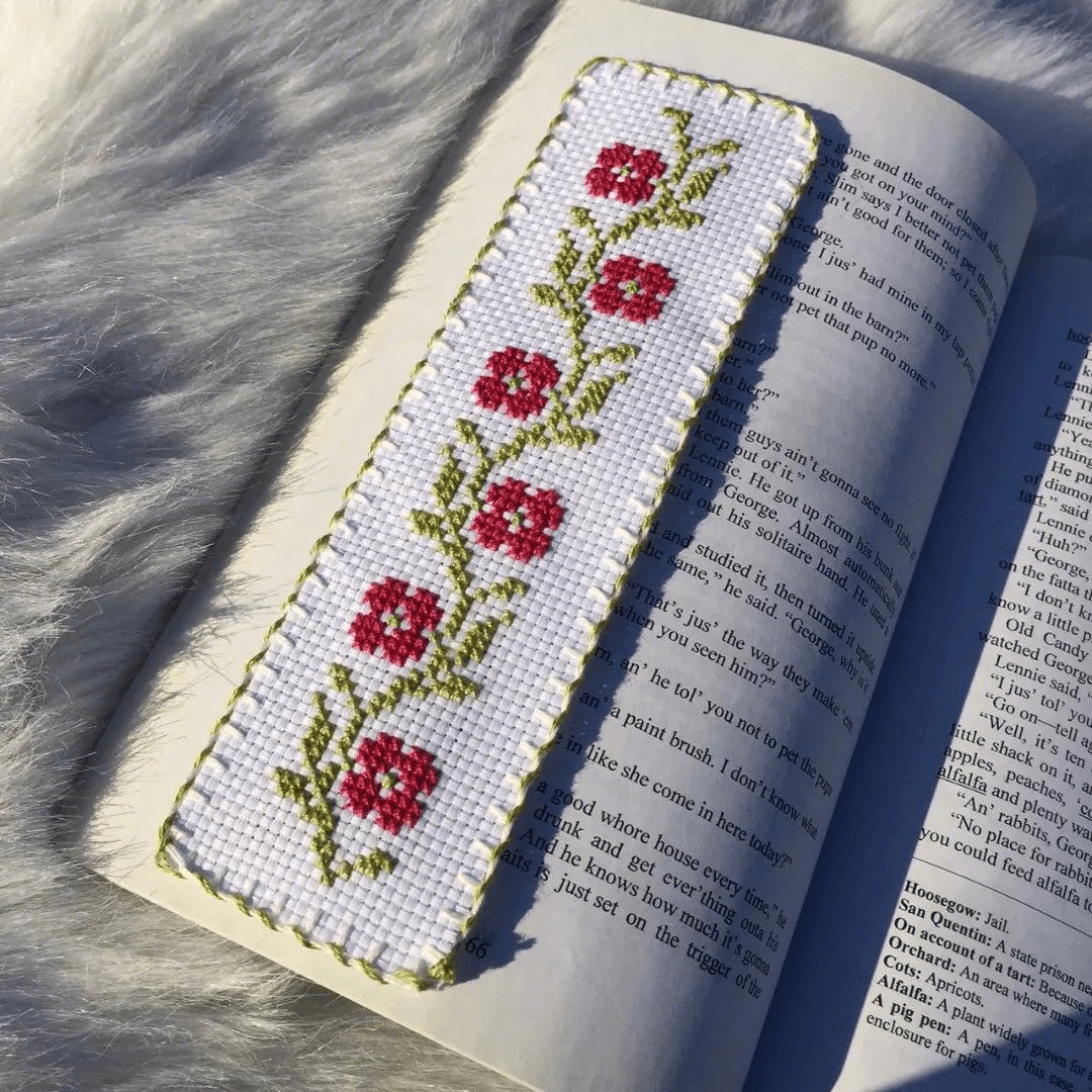 Cross stitch bookmark and colorful floss at the studio